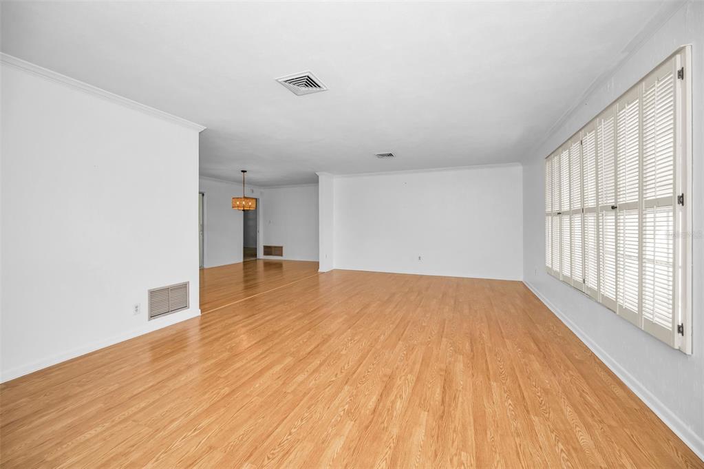 4 Hibiscus Road Belleair, FL 33756 - Photo 18 of 75 a view of empty room with wooden floor and fan