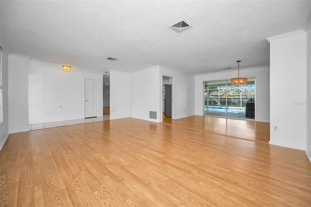 4 Hibiscus Road Belleair, FL 33756 - Photo 19 of 75 a view of empty room with wooden floor and fan