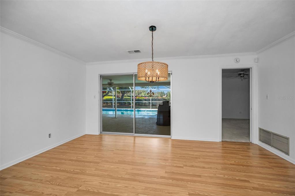 4 Hibiscus Road Belleair, FL 33756 - Photo 20 of 75 a view of a room with wooden floor and ceiling fan