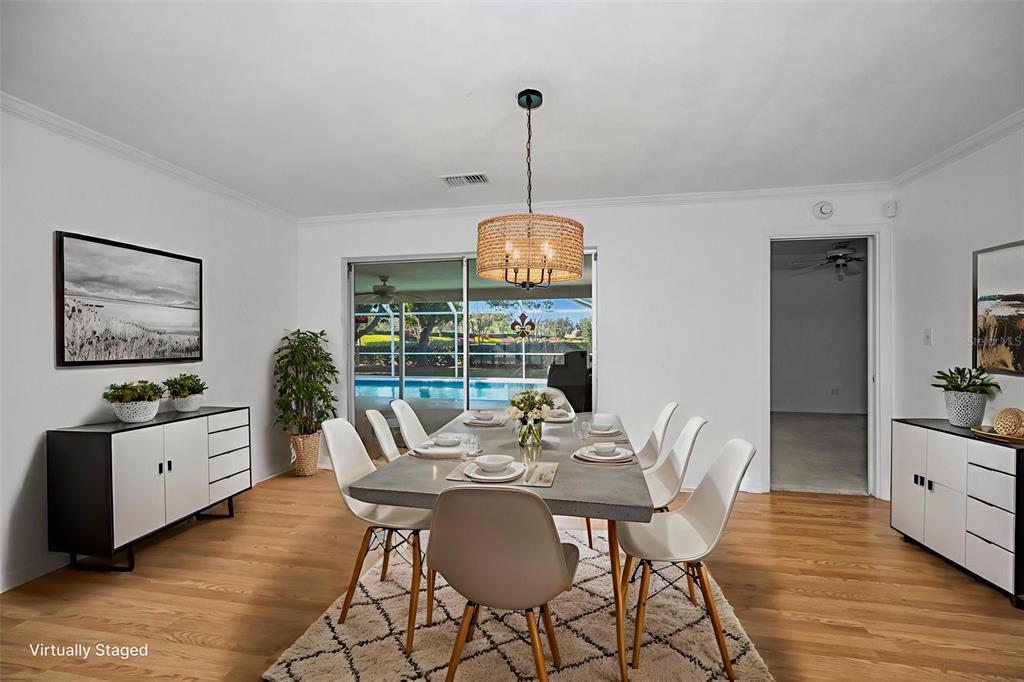 4 Hibiscus Road Belleair, FL 33756 - Photo 21 of 75 a view of a dining room with furniture window and wooden floor