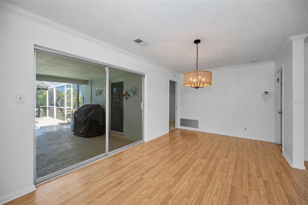 4 Hibiscus Road Belleair, FL 33756 - Photo 22 of 75 a view of a room with wooden floor and ceiling fan