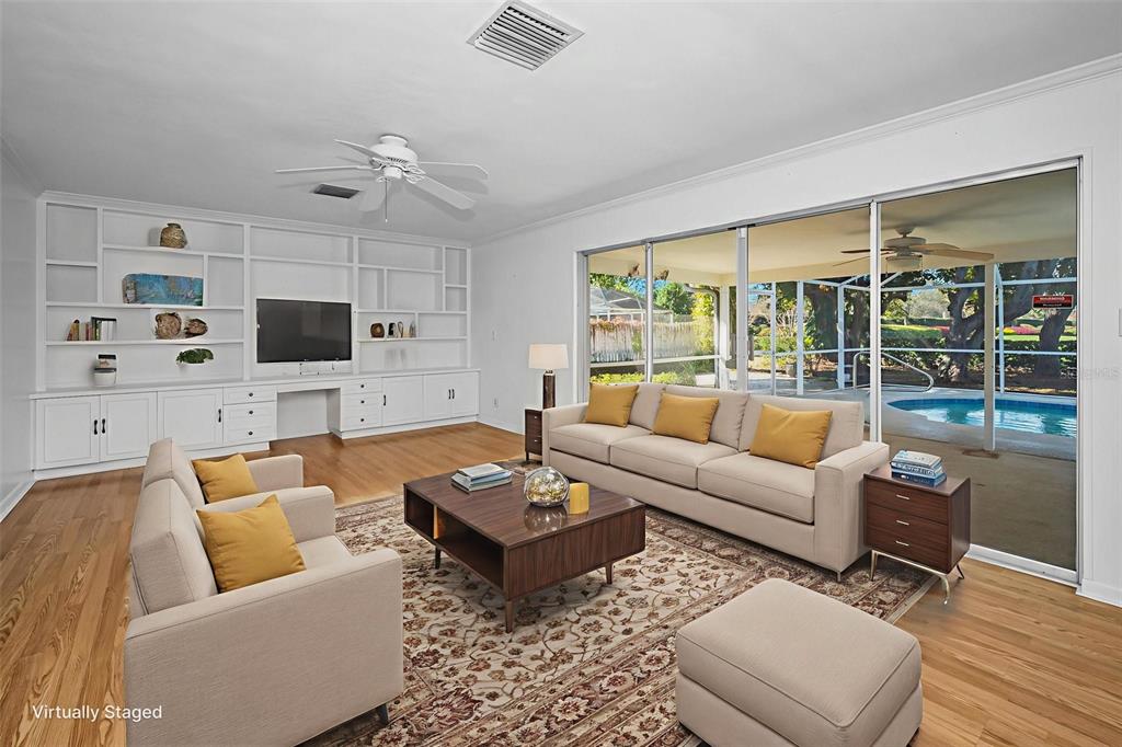 4 Hibiscus Road Belleair, FL 33756 - Photo 30 of 75 a living room with furniture flat screen tv and a large window