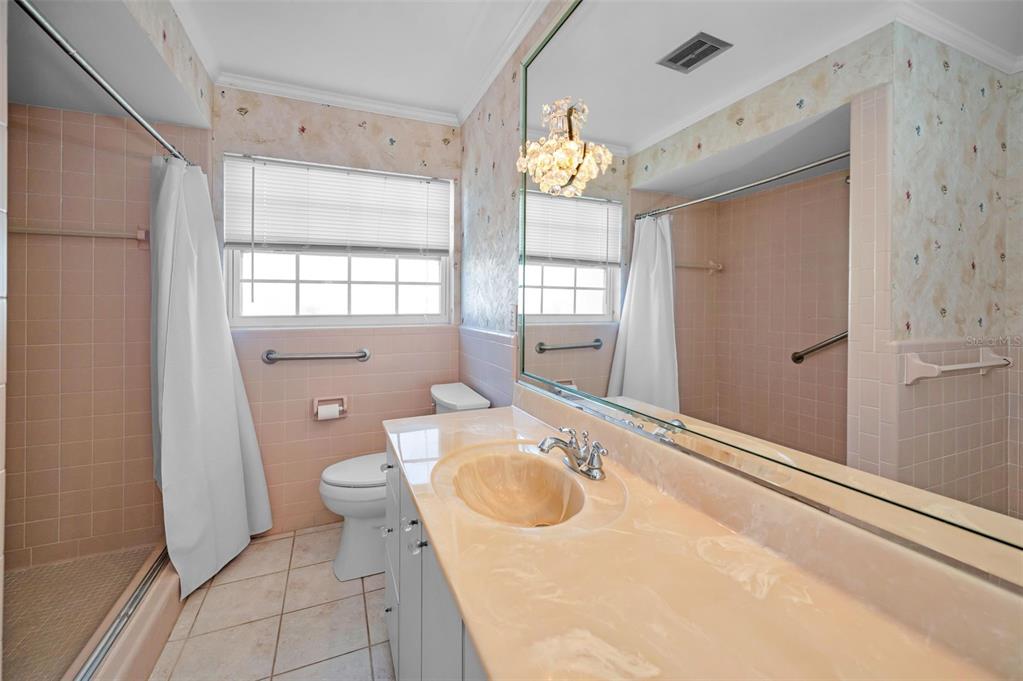 4 Hibiscus Road Belleair, FL 33756 - Photo 38 of 75 a bathroom with a sink toilet and shower
