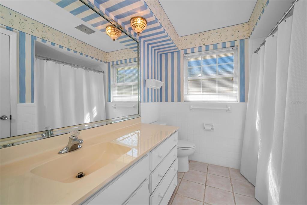 4 Hibiscus Road Belleair, FL 33756 - Photo 43 of 75 a bathroom with a sink and a bathtub