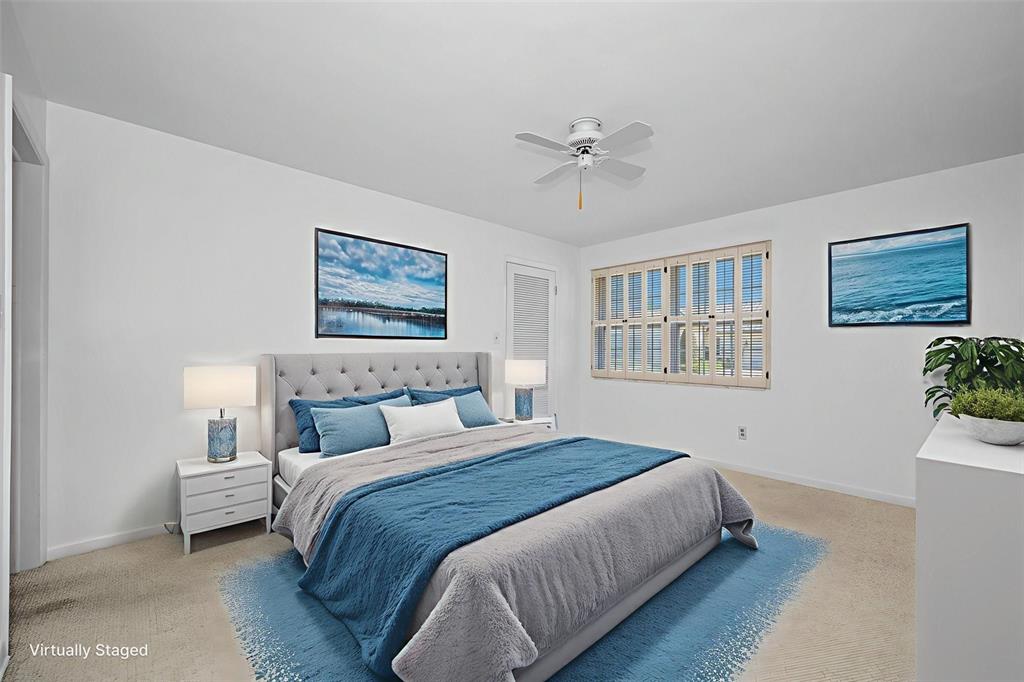4 Hibiscus Road Belleair, FL 33756 - Photo 46 of 75 a bedroom with a large bed and a window