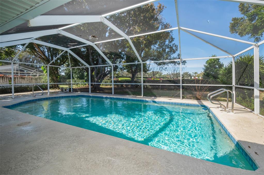 4 Hibiscus Road Belleair, FL 33756 - Photo 51 of 75 a view of a swimming pool with a yard