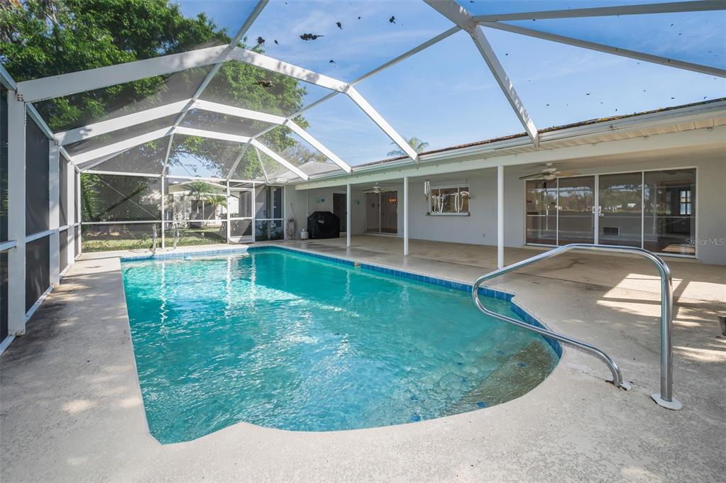 4 Hibiscus Road Belleair, FL 33756 - Photo 54 of 75 a view of a house with backyard porch and sitting area