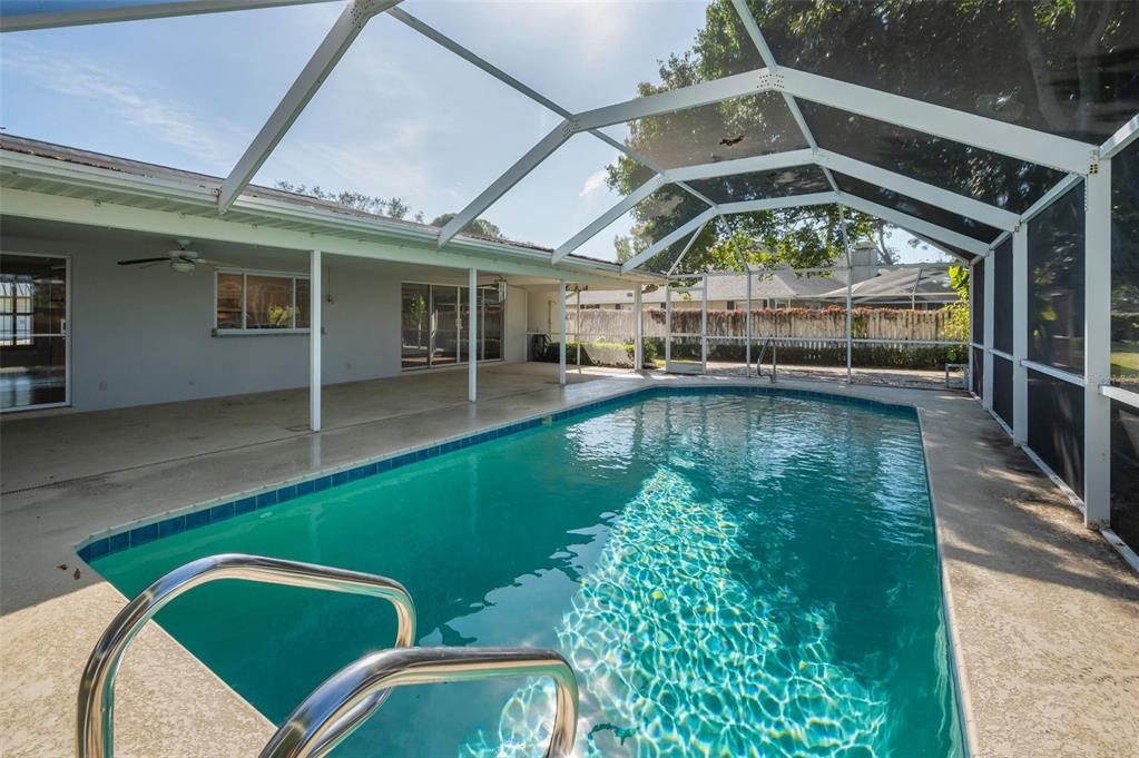 4 Hibiscus Road Belleair, FL 33756 - Photo 55 of 75 a view of a swimming pool with a patio