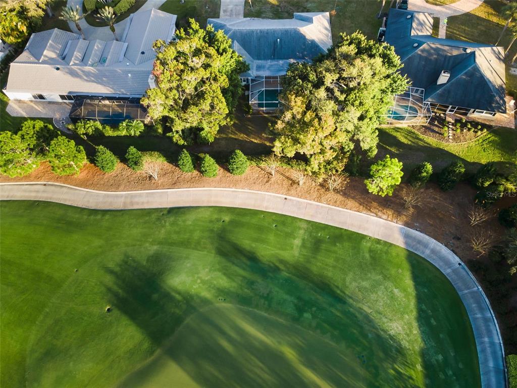 4 Hibiscus Road Belleair, FL 33756 - Photo 66 of 75 a view of a lake with a building in the background