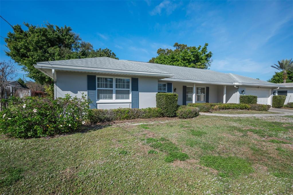 4 Hibiscus Road Belleair, FL 33756 - Photo 8 of 75 a front view of a house with a garden