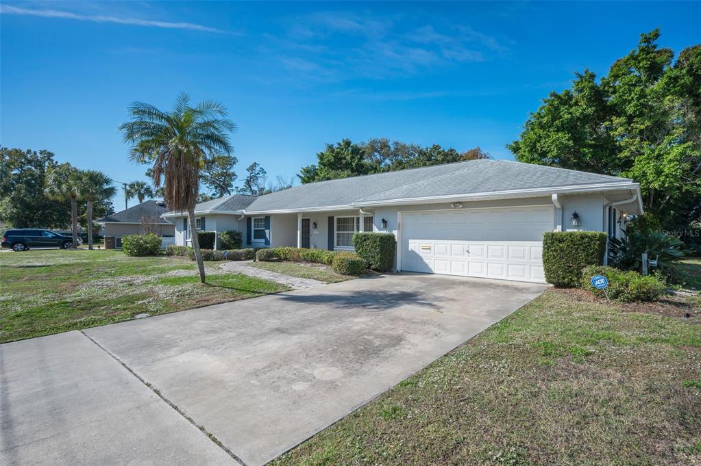 4 Hibiscus Road Belleair, FL 33756 - Photo 10 of 75 a front view of house with yard and green space