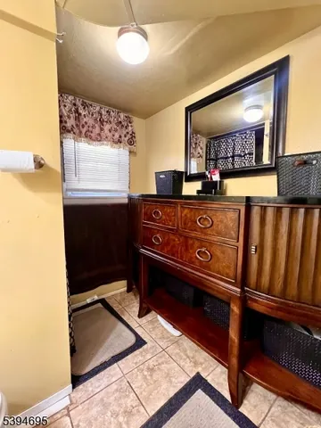 a view of a hallway with furniture