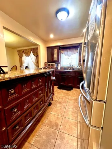 a kitchen with a sink appliances and cabinets