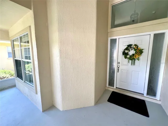 a view of walk in closet with living room