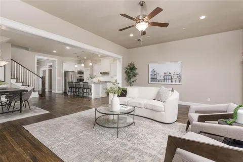 a living room with furniture a fireplace and a table