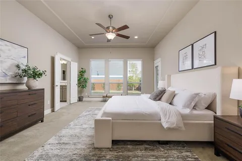 a living room with furniture and a dining table with wooden floor