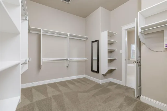 a bathroom with a sink a large mirror and a bathtub