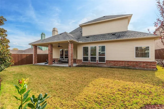 a view of a two chairs in the balcony