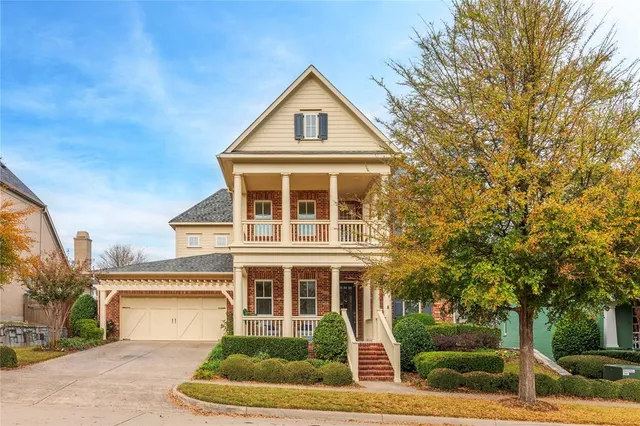 a view of a house with backyard and porch