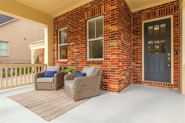 a view of an outdoor space with porch and wooden floor