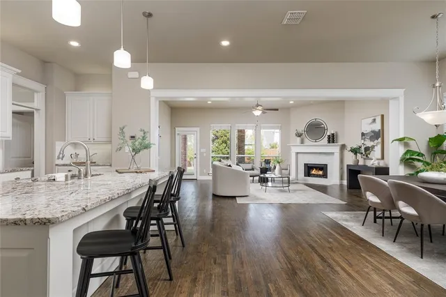 a view of a a dining room with furniture window and wooden floor