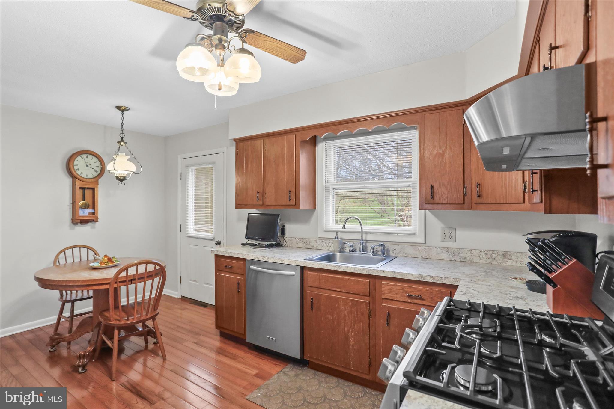 114 Lexington Road York, PA 17402 - Photo 16 of 49 a kitchen with stainless steel appliances granite countertop a sink a stove and a refrigerator