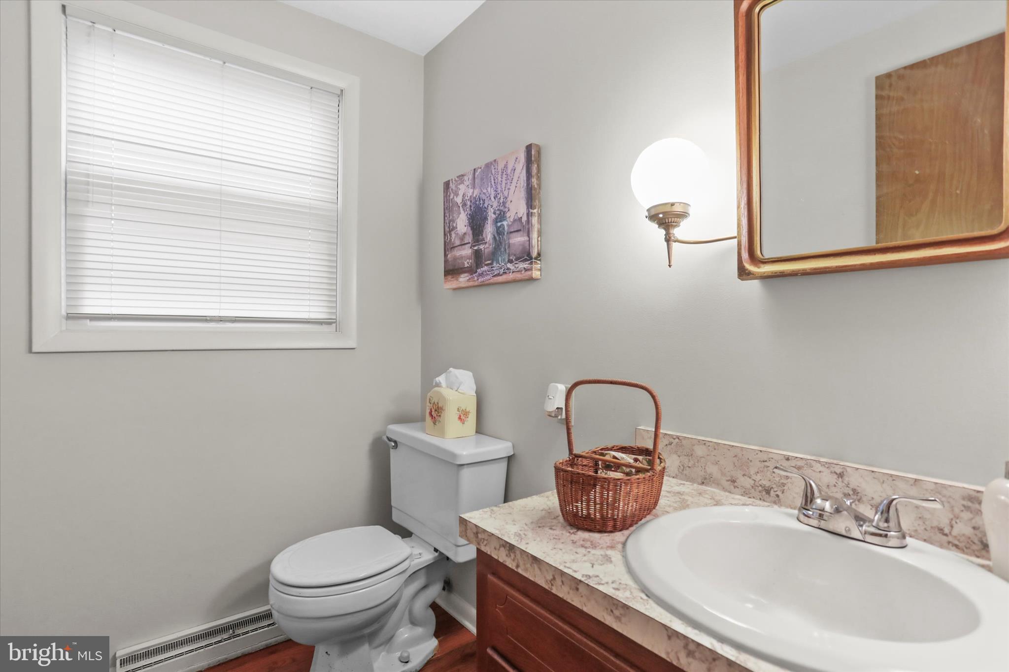 114 Lexington Road York, PA 17402 - Photo 18 of 49 a bathroom with a toilet sink and mirror