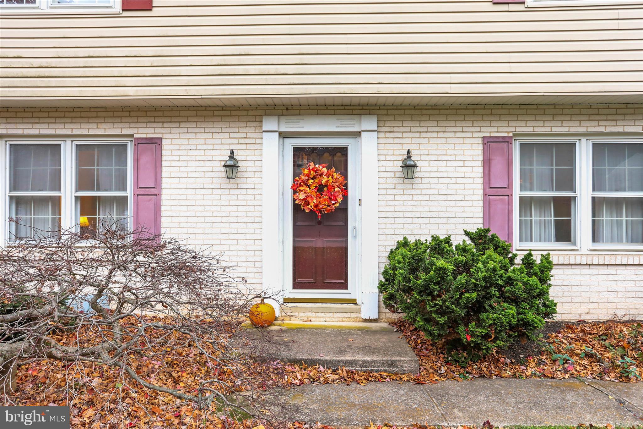 114 Lexington Road York, PA 17402 - Photo 2 of 49 a view of a house with potted plants and a large window