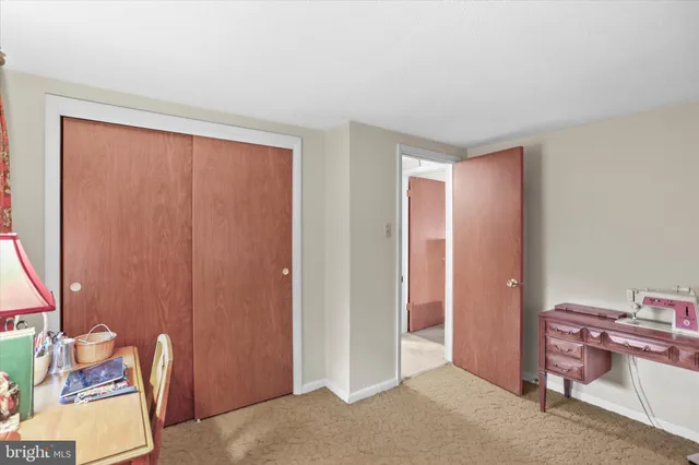 a view of room with furniture and a window