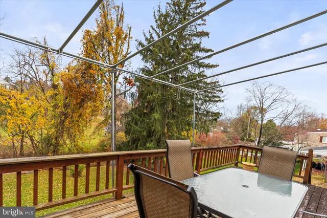 a view of a chairs and table in the balcony