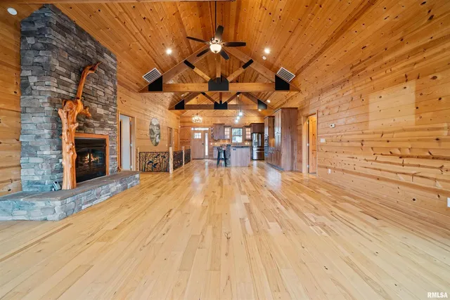a view of a kitchen with cabinets and wooden floor