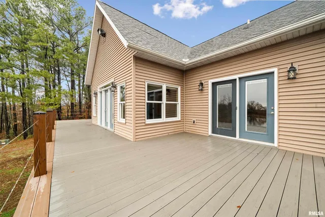 a view of front door and porch with wooden floor