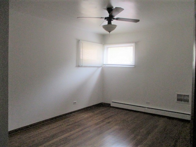 512 Highland Road Hinsdale, IL 60521 - Photo 17 of 25 an empty room with a window and a ceiling fan