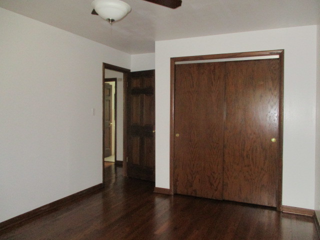 512 Highland Road Hinsdale, IL 60521 - Photo 21 of 25 an empty room with wooden floor door and closet