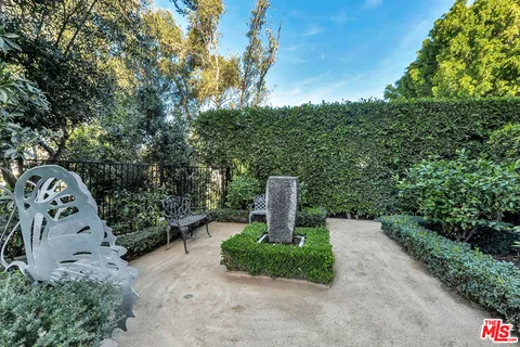 a view of a garden with a fountain