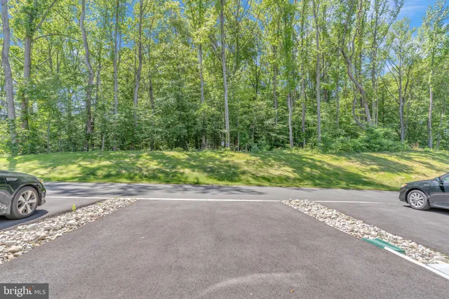 a view of a street with a parked car