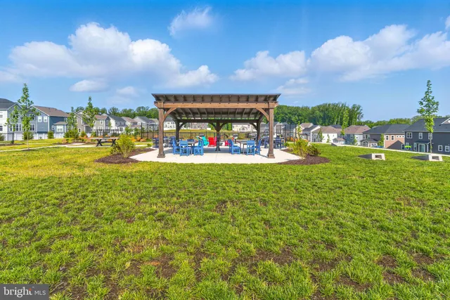 a view of a patio with a table and chairs