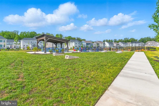 an outdoor space with swimming pool and furniture
