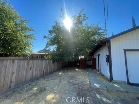 a view of a house with a backyard