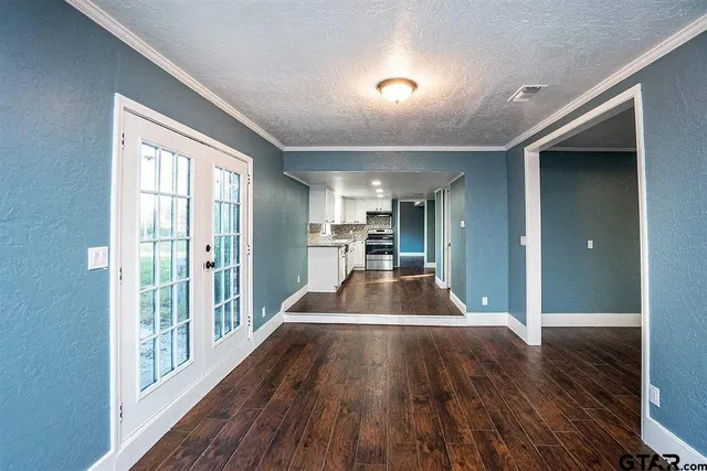 a view of a living room and a large window