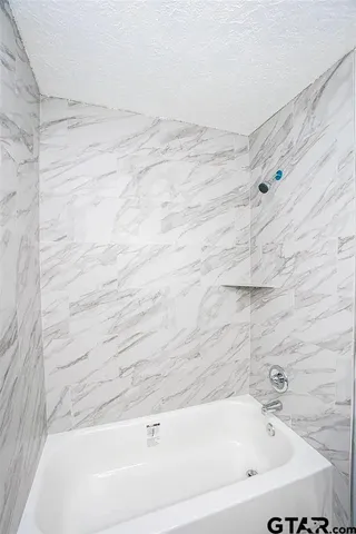 a bathroom with a bathtub