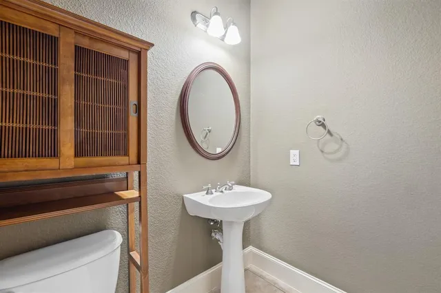 a living room with furniture a table and a large window