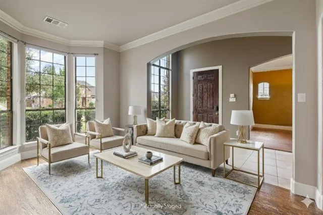 a living room with furniture rug and window