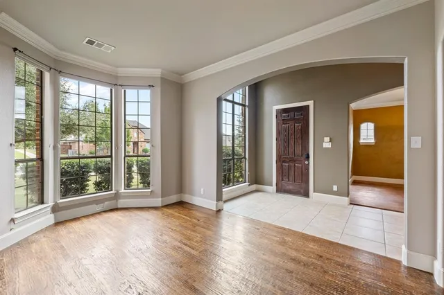 a view of livingroom with furniture wooden floor and front door