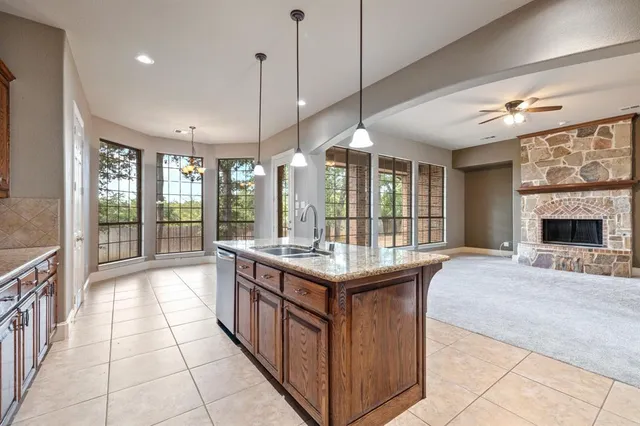 a living room with furniture chandelier and a fireplace