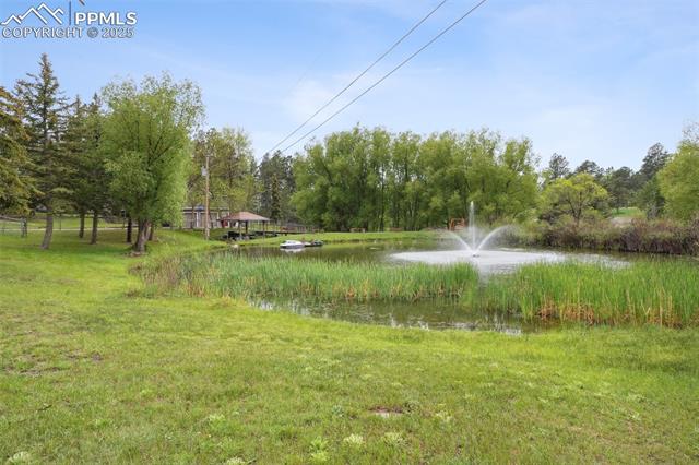 7475 Chirgiton Road Colorado Springs, CO 80908 - Photo 2 of 38 View of yard with a water view