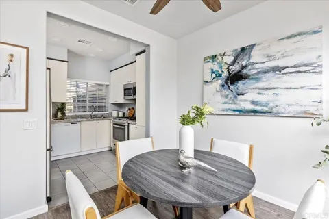 a kitchen with stainless steel appliances a refrigerator sink and microwave