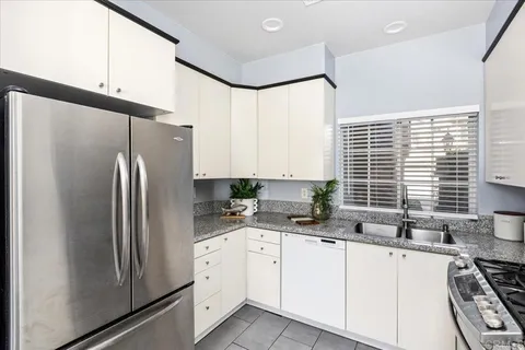 a dining room with furniture potted plants and a fireplace