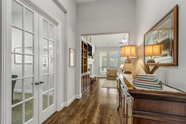 a view of living room kitchen and entryway