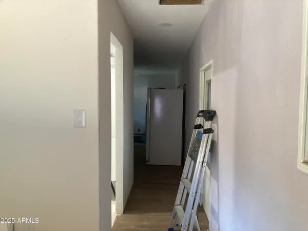 a view of a room with closet and windows
